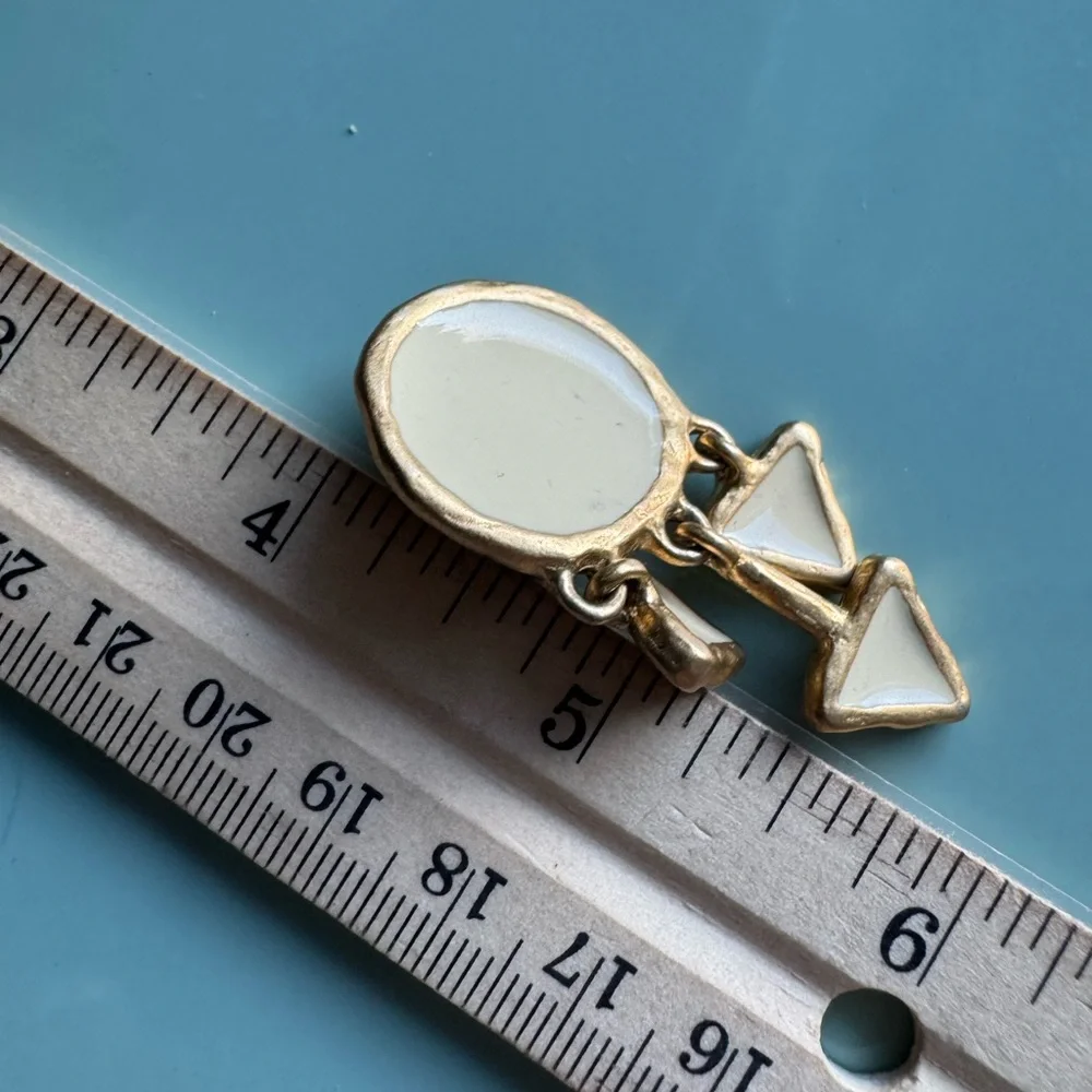 Vintage cream enamel and gold tone clip on dangle earrings